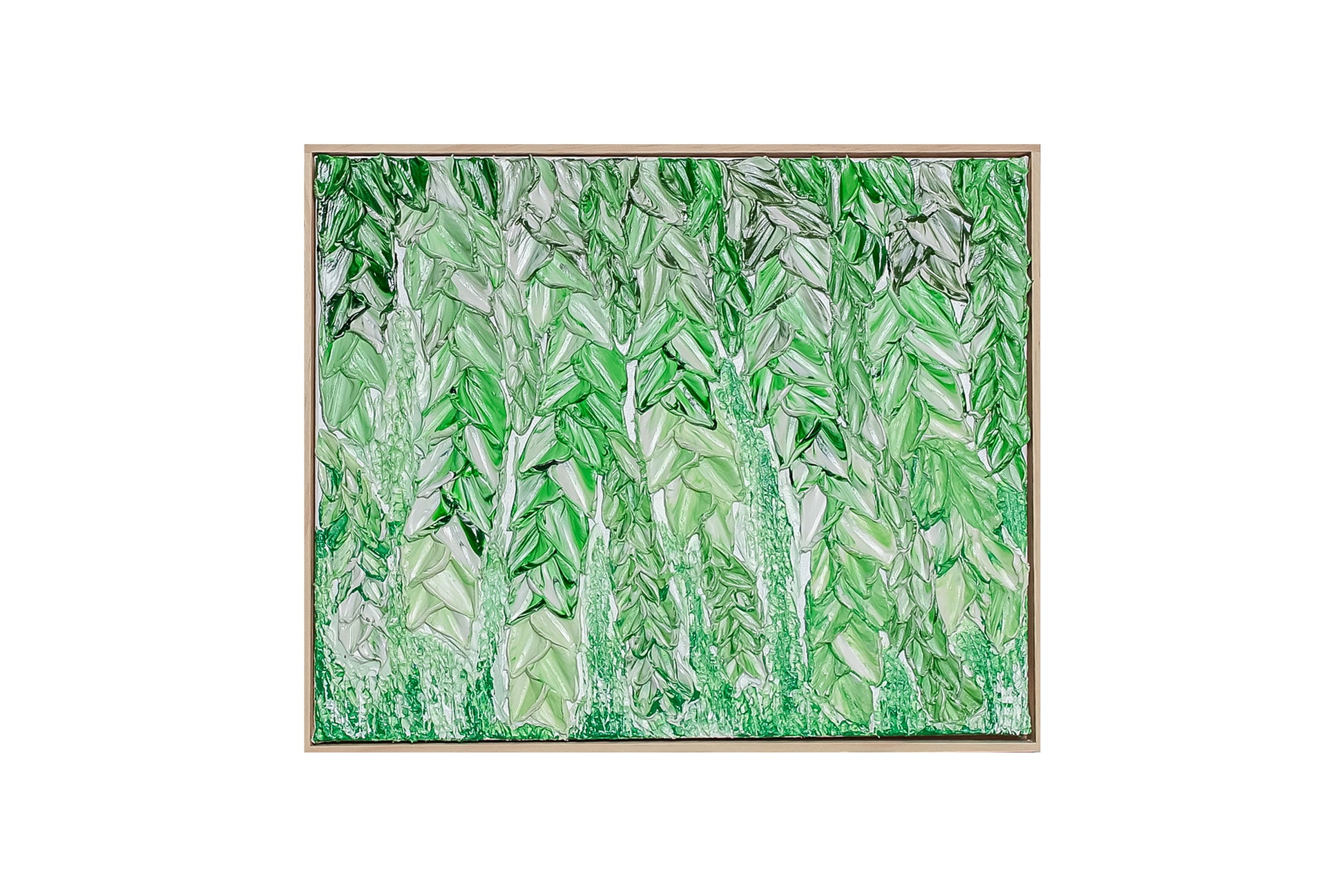 A framed abstract painting featuring textured vertical brushstrokes in various shades of green and white, enclosed in a thin light wood frame against a solid white background.