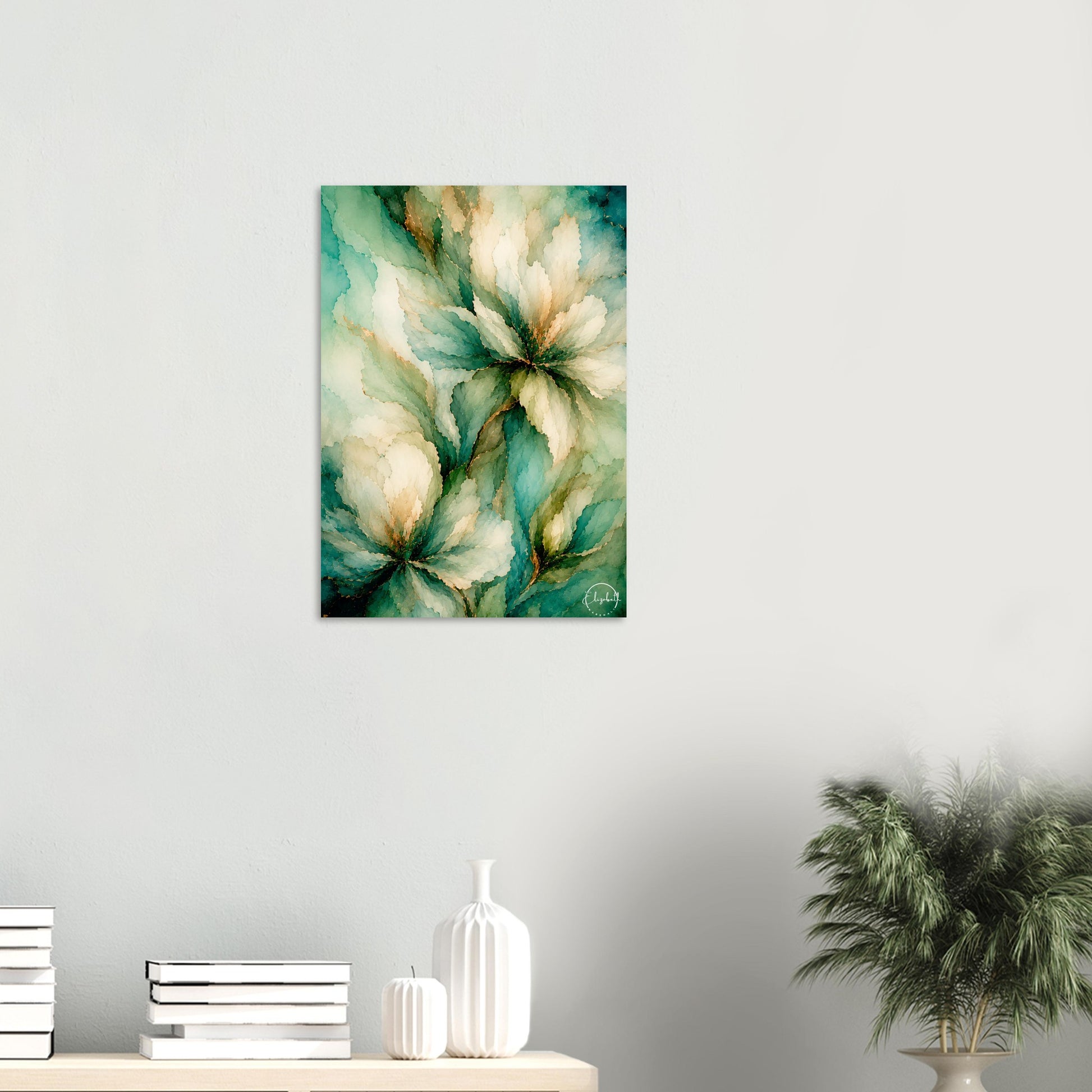 A vertical canvas wall art print featuring an abstract floral painting in teal, cream, and gold tones, displayed on a light gray wall above a console table with books and decorative vases.