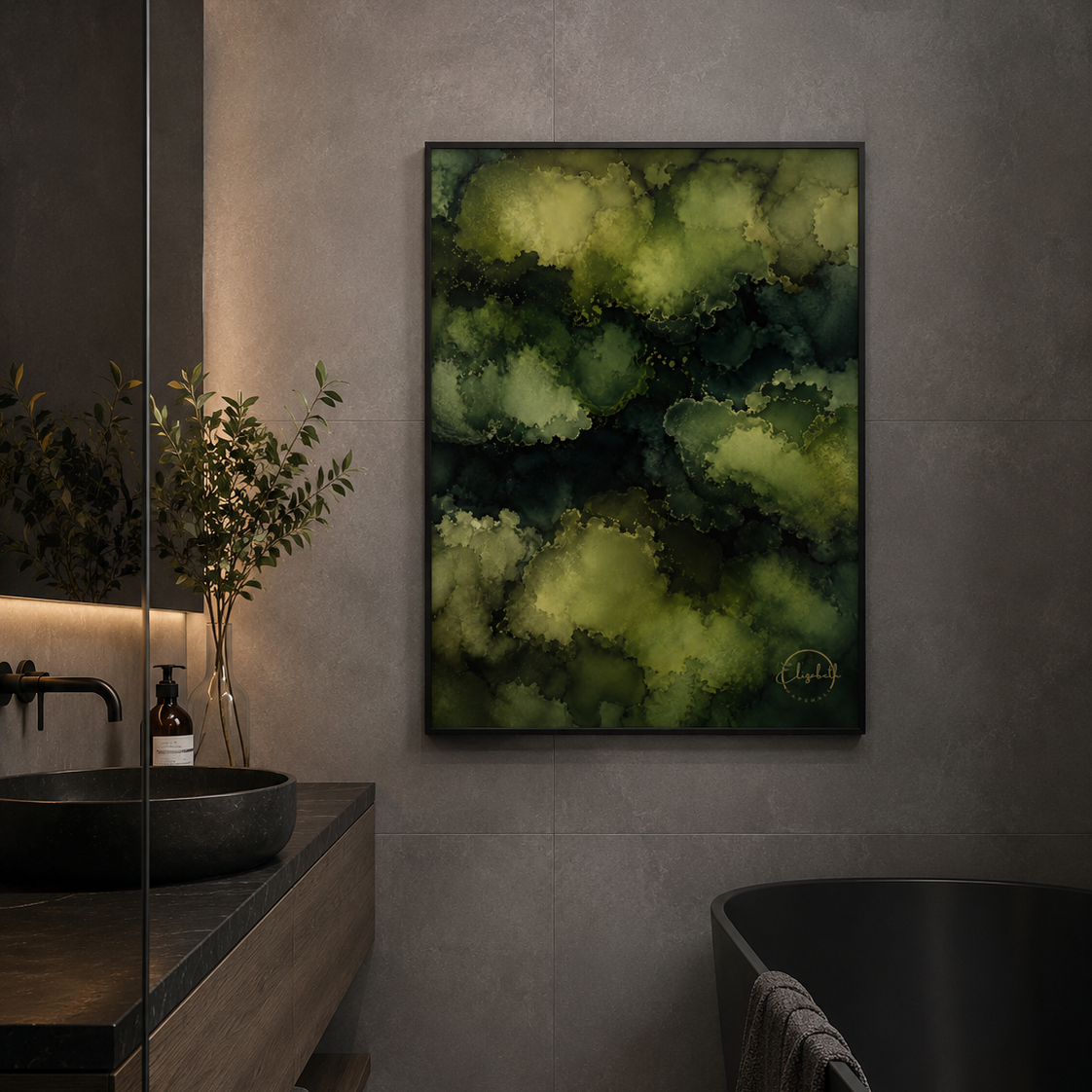 Abstract framed wall art featuring layered green and yellow-green cloud-like forms, displayed in a modern bathroom setting above a dark bathtub and beside a wooden vanity.
