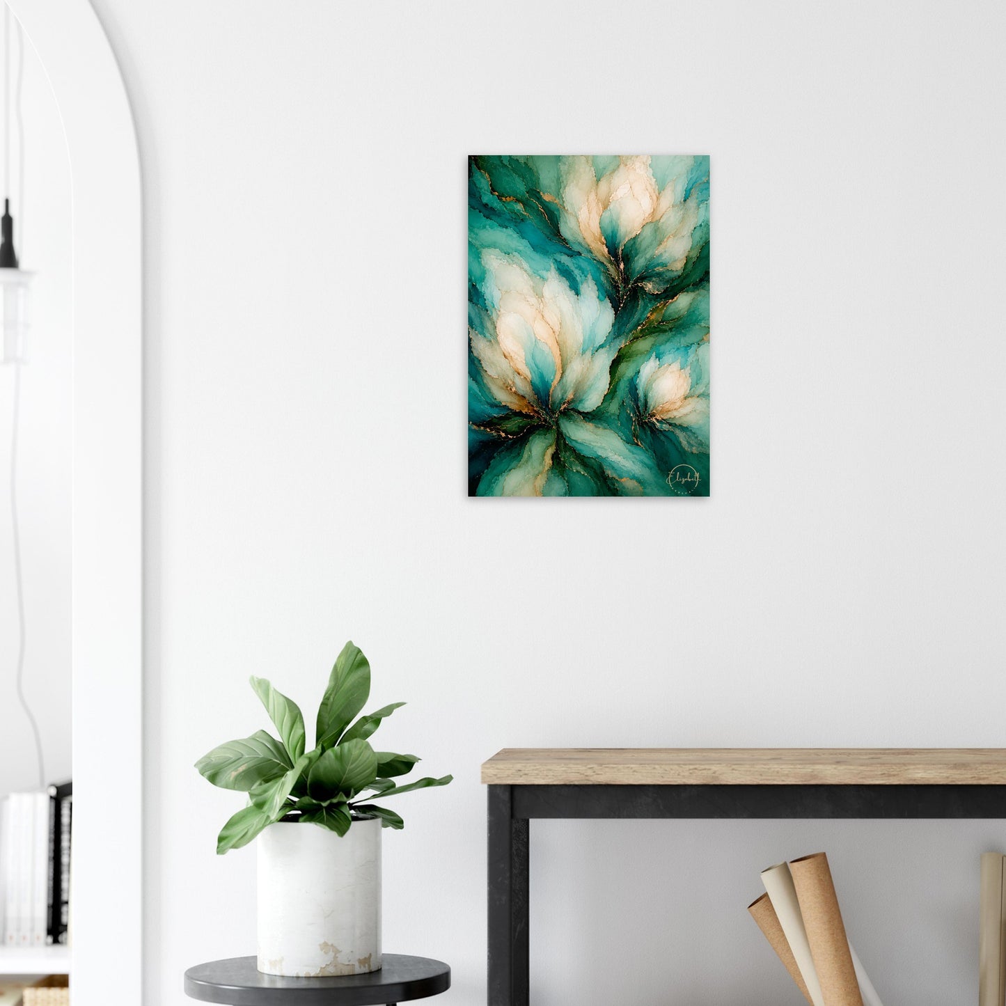 A vertical abstract floral canvas print with teal, green, and cream tones, displayed on a white wall above a wooden console table with a potted plant.