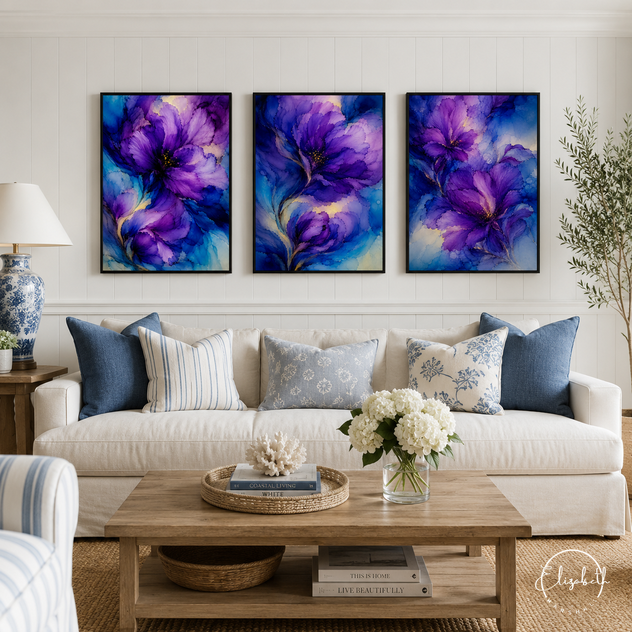set of three moody purple artworks in a living room 