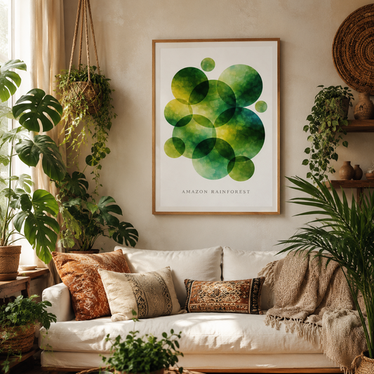 A framed art print featuring green overlapping circles labeled 'AMAZON RAINFOREST' hangs on a beige wall above a white sofa in a cozy, plant-filled living room.