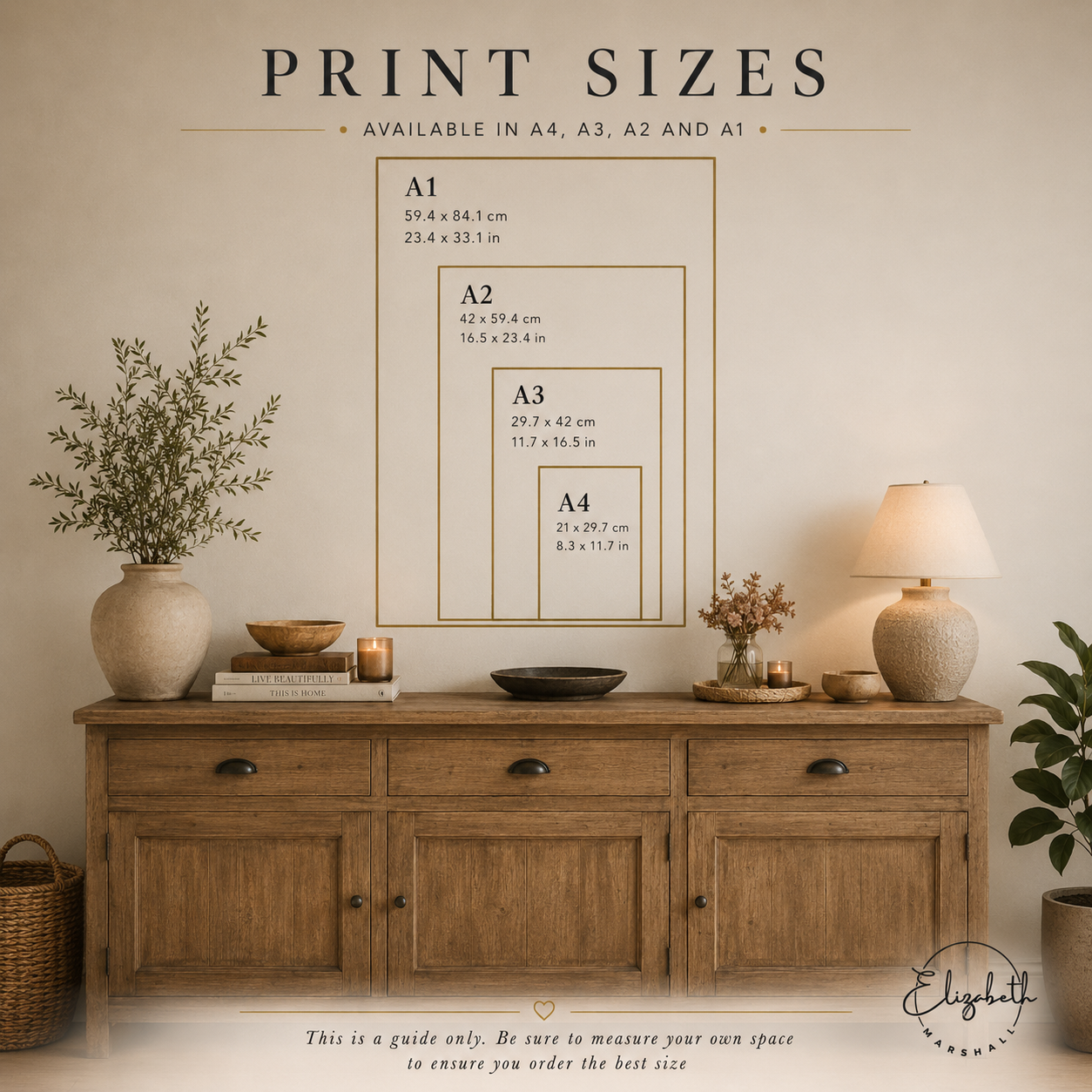 Room interior with wooden sideboard, decor items, and a print size chart on the wall.