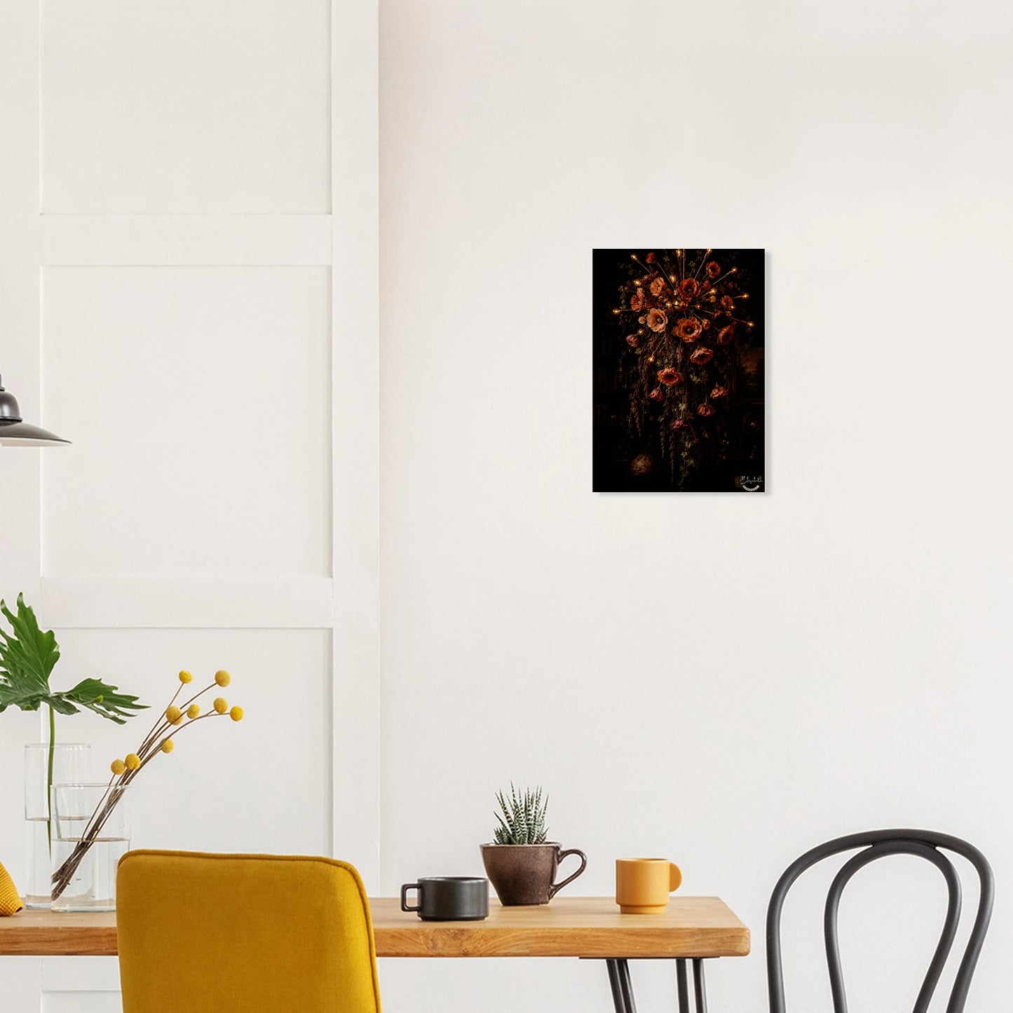 A dark, moody floral arrangement featuring large poppy-like flowers in muted red, pink, and orange tones with warm glowing lights along the stems, set against a very dark background. The artwork is presented as a vertical print with a white border and a small signature in the lower right corner.