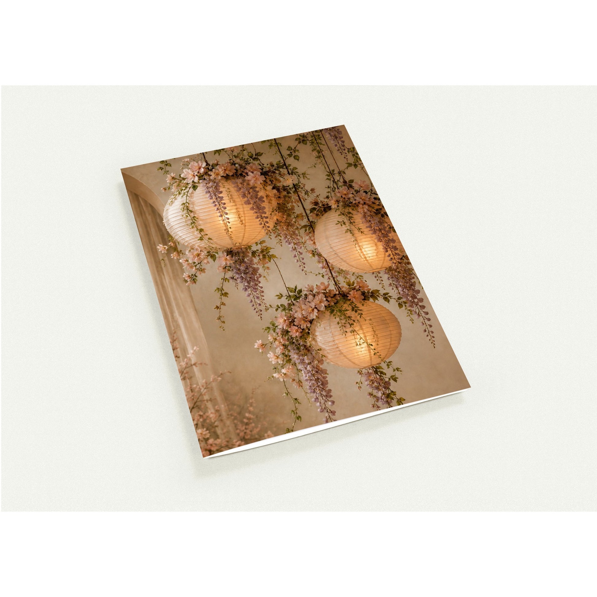 Decorative card with floral and paper lantern design on a white background