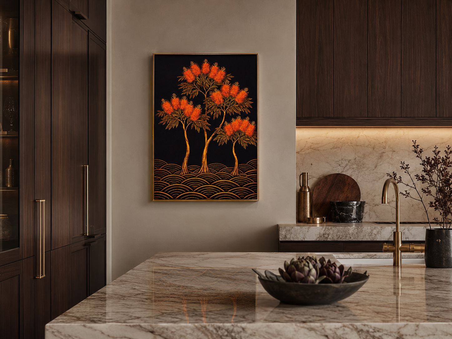 A framed wall art print featuring stylized orange trees on a black background with gold wave-like lines, displayed in a modern kitchen setting above a marble countertop.