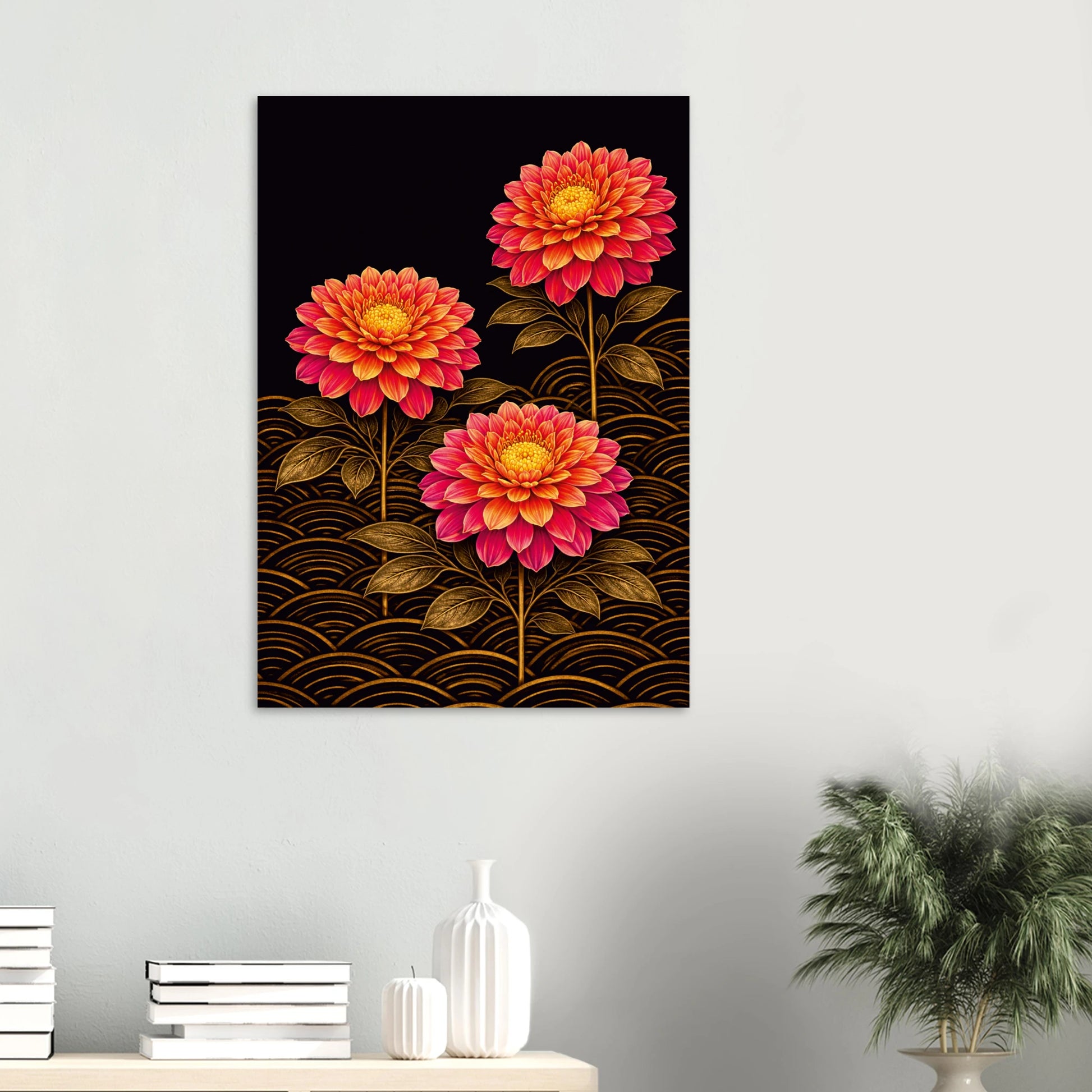 A vertical wall art print featuring three stylized pink and orange flowers with gold wave patterns on a black background, displayed on a light gray wall above a console table with books and a plant.