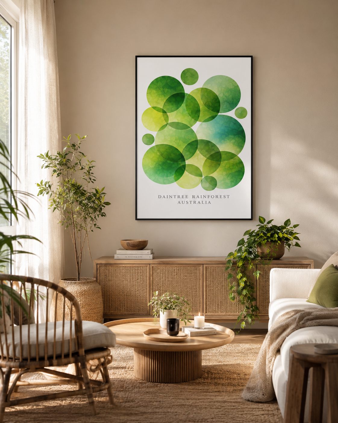 A framed wall art print featuring overlapping green watercolor circles with the text 'Daintree Australia ' at the bottom, displayed in a styled living room above a wooden cabinet.