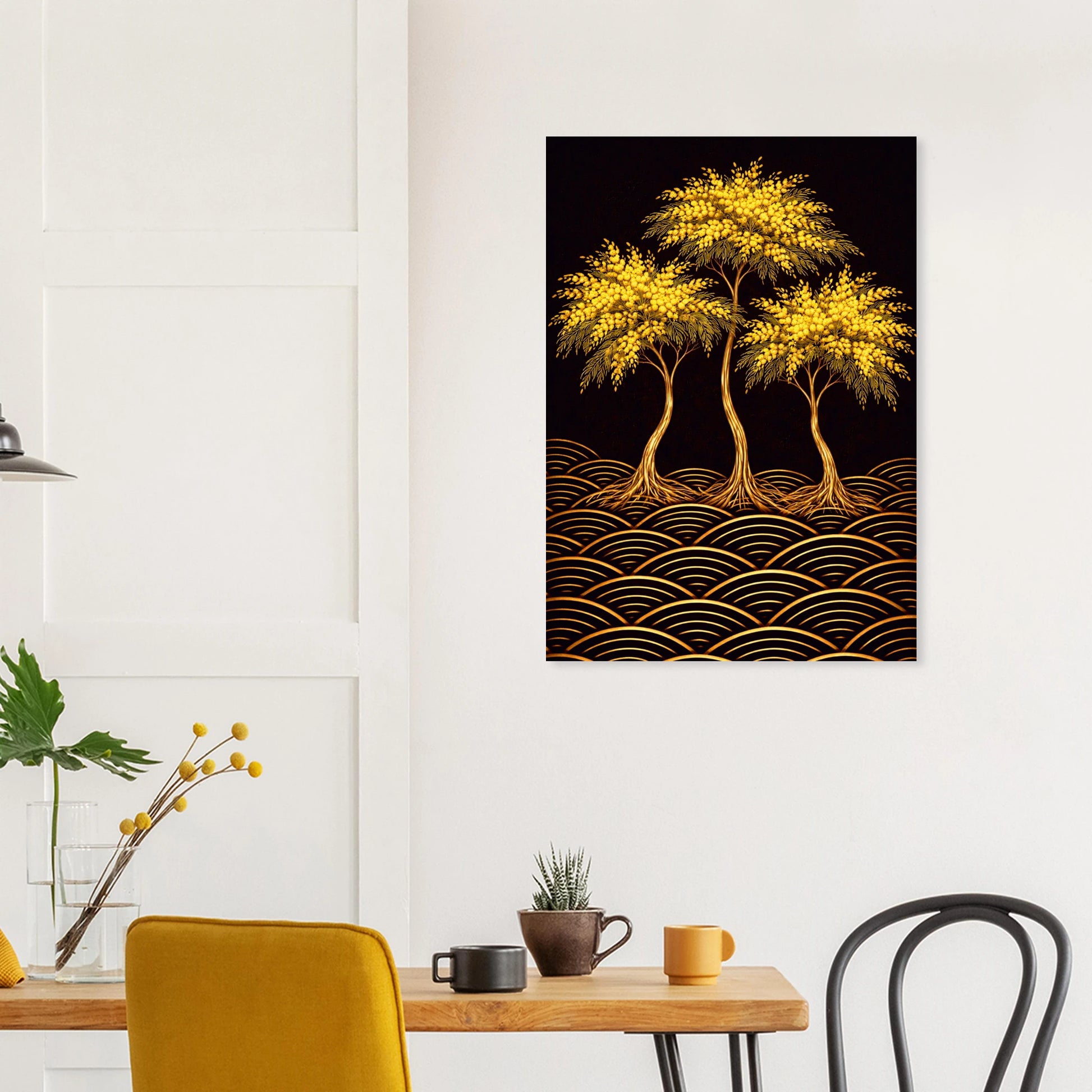 A vertical wall art print depicting three glowing golden trees over a black background with gold wave-like patterns, displayed above a dining table in a modern room setting.