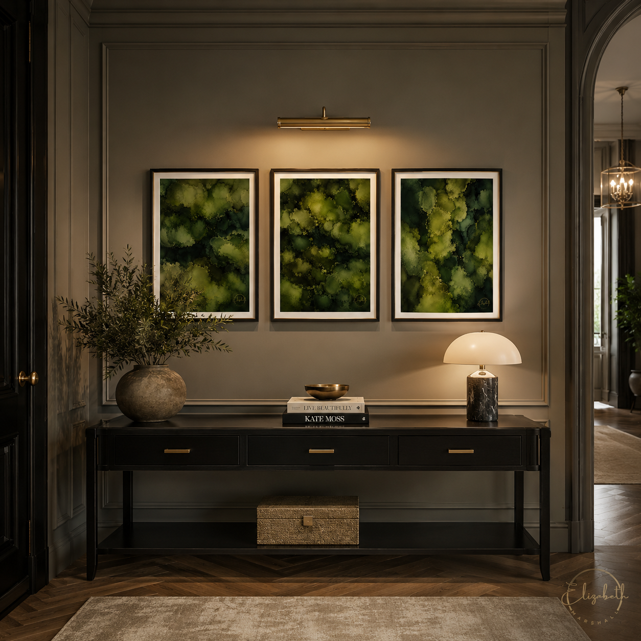 A three-piece framed wall art set featuring abstract green and yellow textured patterns, displayed in a modern entryway above a dark wood console table.