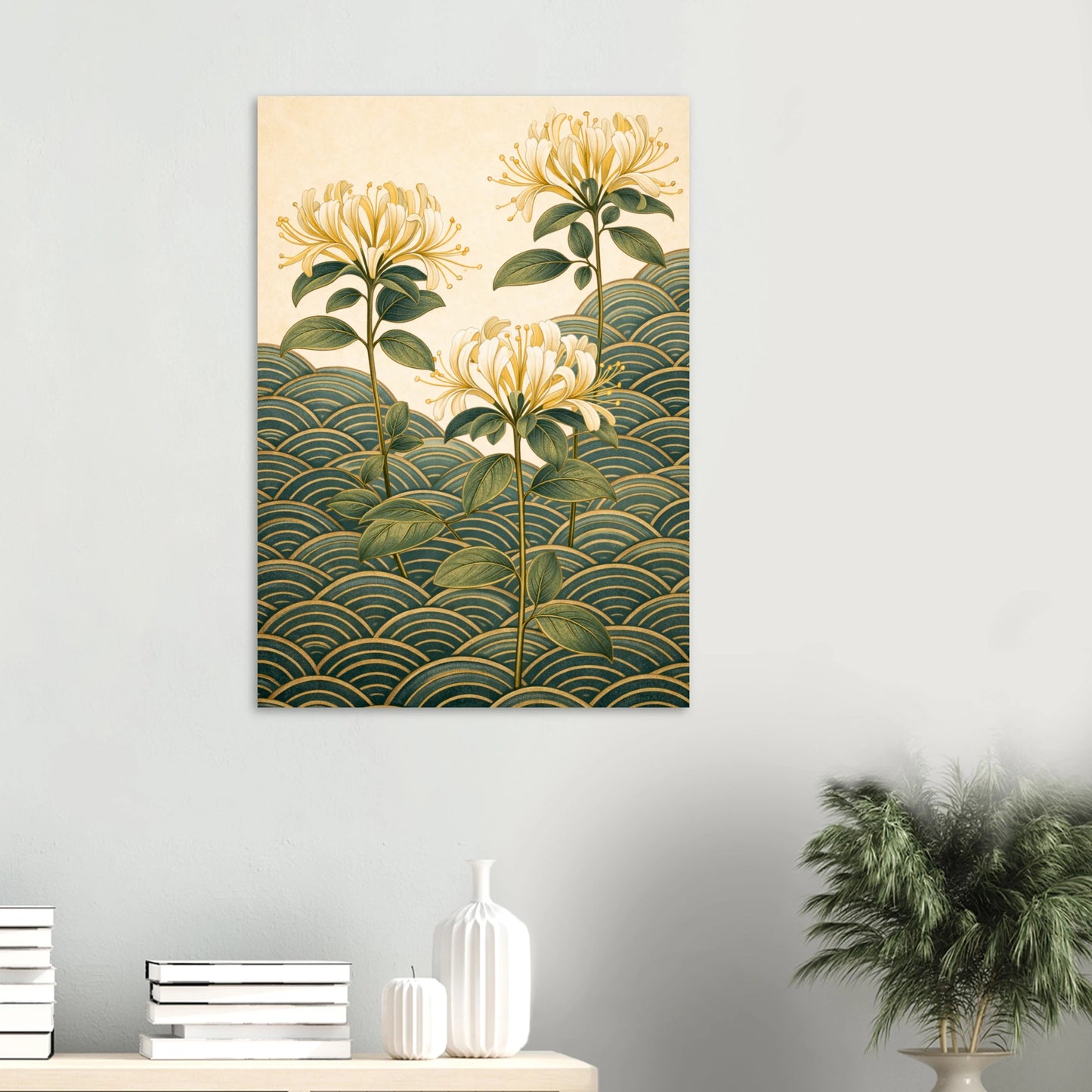 A vertical wall art print featuring three golden-yellow flowers with green leaves rising above a green and gold wave pattern, displayed on a light gray wall above a console table with books and a plant.