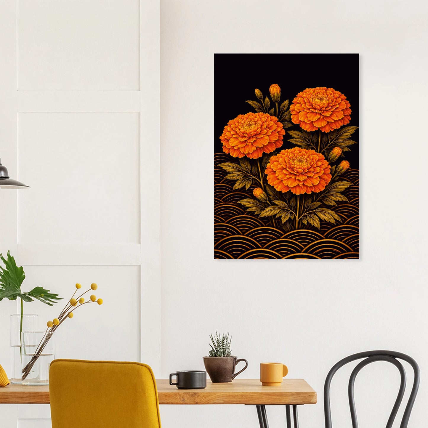 A vertical canvas wall art print featuring three vibrant orange marigold flowers with gold wave patterns on a black background, displayed on a white wall above a dining table with chairs and mugs.