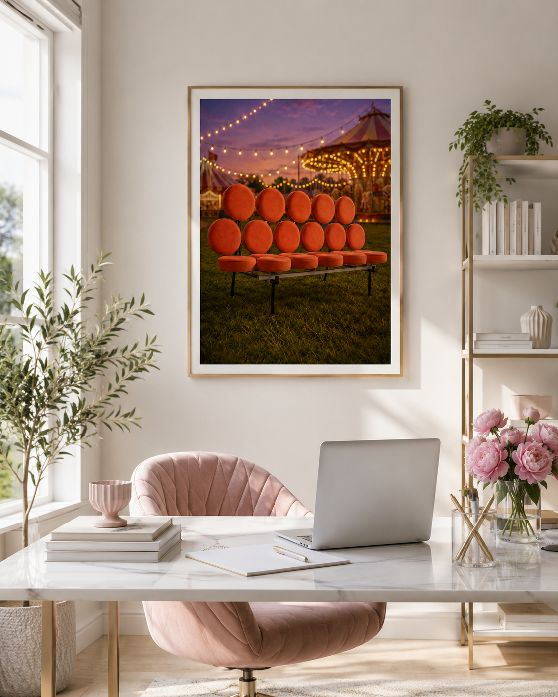 A framed art print depicting an orange vintage soga in front of a circus tent at dusk, displayed on a wall above a desk in a styled home office setting.