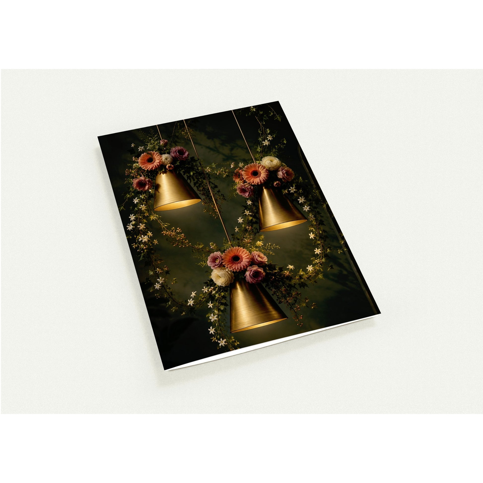 card with gold pendant lights and floral decorations on a dark background