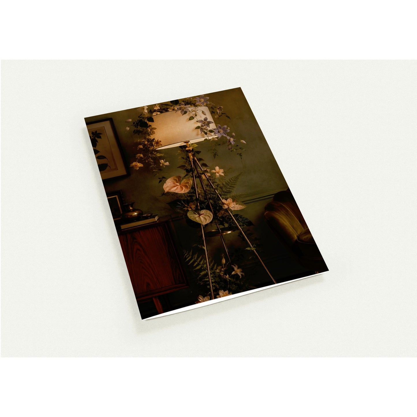 Floral arrangement on a stand with a lamp in a room setting
