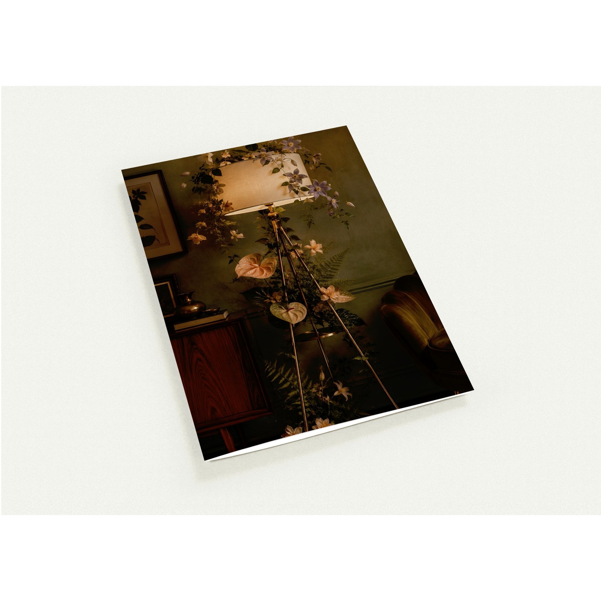 Floral arrangement on a stand with a lamp in a room setting