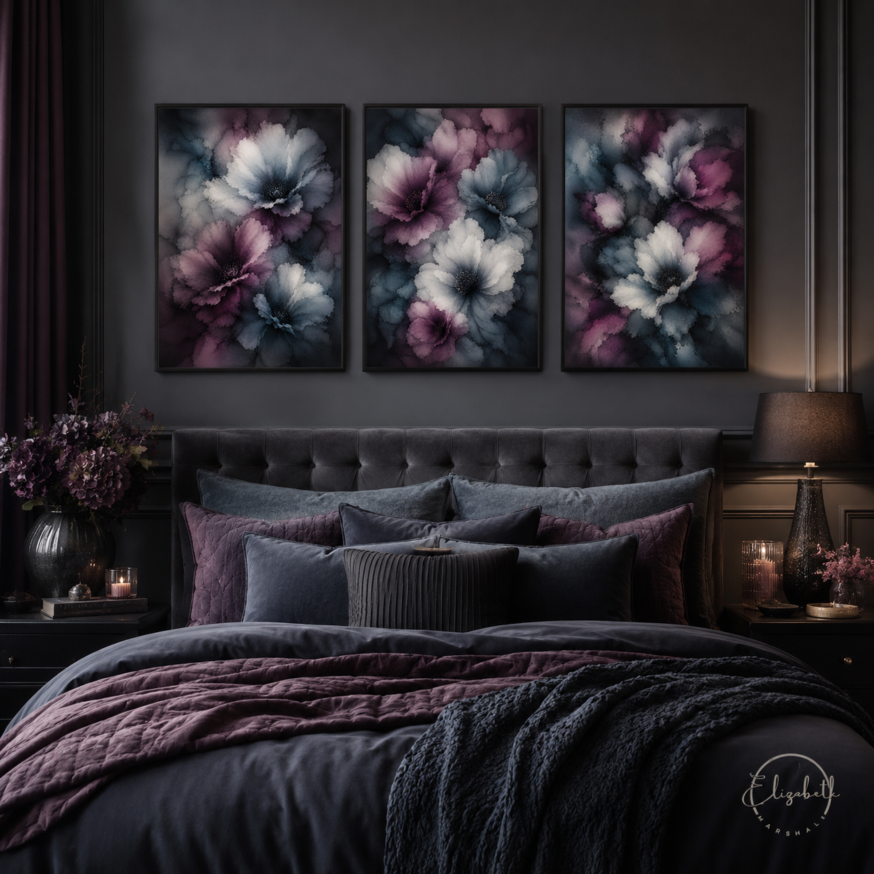 A dark, moody bedroom featuring three vertical framed canvas prints with large abstract floral designs in purple, blue, and white, hung above a dark tufted bed with matching pillows and a textured blanket.