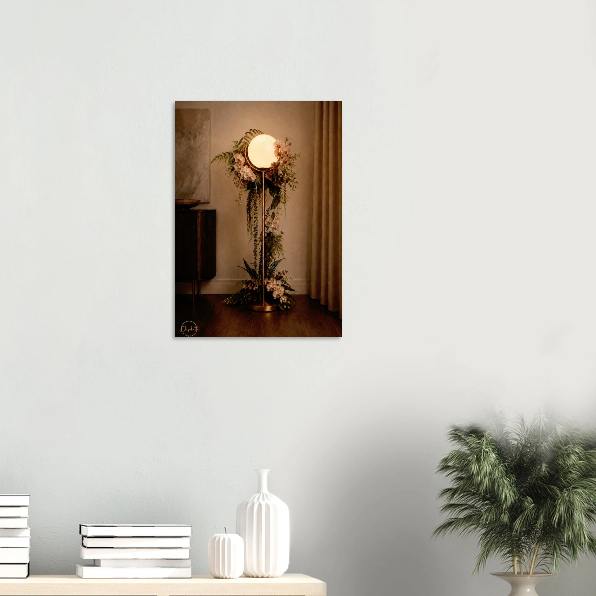 A vertical wall art print depicting a vintage-style floor lamp adorned with floral arrangements, displayed on a light gray wall above a console table with decorative vases and a potted plant.