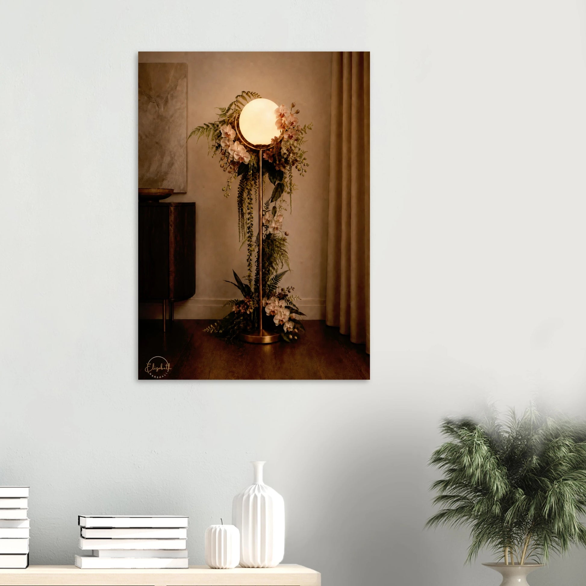 A vertical wall art print depicting a vintage-style floor lamp adorned with floral arrangements, displayed on a light gray wall above a console table with decorative vases and a potted plant.