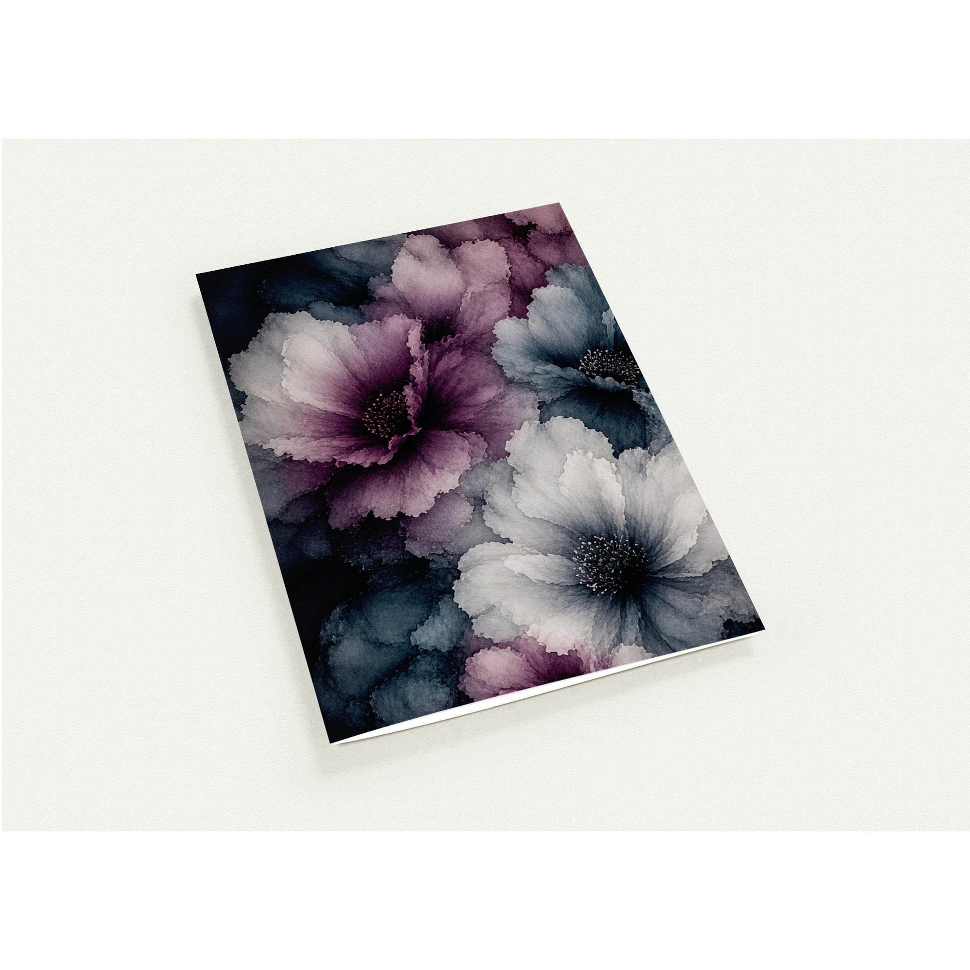 A note card with a dark floral cover design featuring purple, blue, and white flowers, photographed at an angle on a light off-white background.

Ten note cards that feel like a tiny gallery in an envelope. Rich, moody florals, deep jewel tones, and the kind of lush, layered colour that makes a handwritten note feel like a gift before it's even opened. These are the cards for people who believe that stationery should be as beautiful as the words inside.