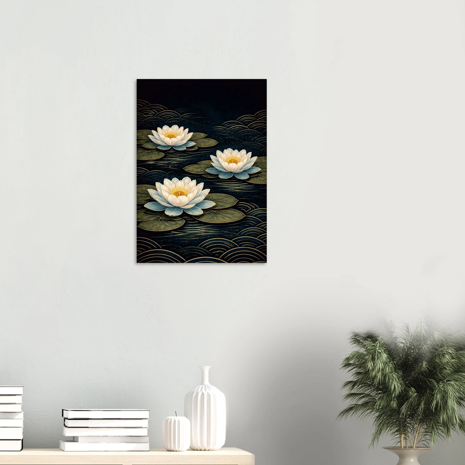 Waterlilies at Midnight floats three luminous blooms across a deep dark background, their ivory and blue-white petals opening wide around golden centres, resting on dark olive lily pads while gold seigaiha waves ripple silently beneath. Still, serene and quietly breathtaking, this is a print that brings calm to any room it enters.