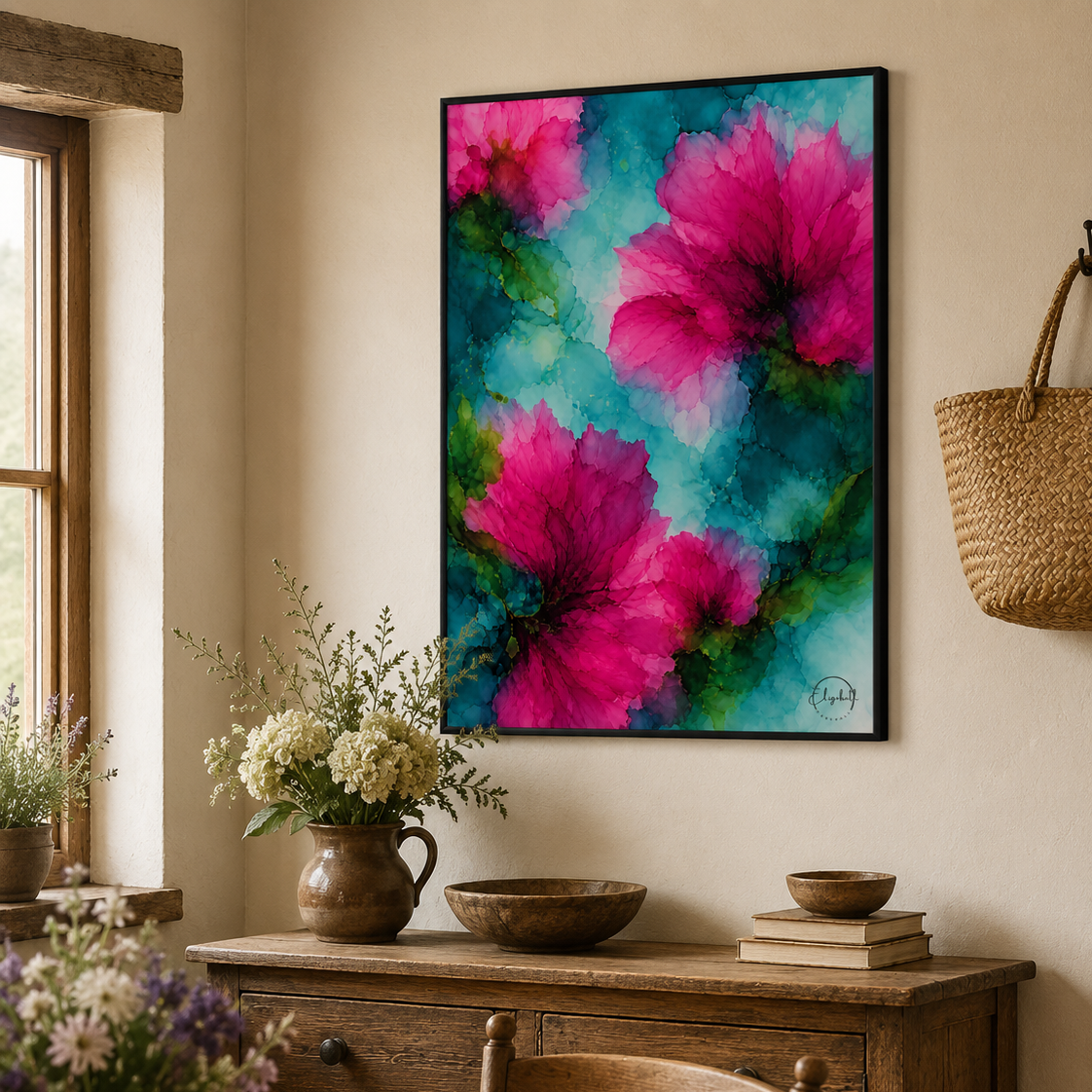 A framed vertical canvas print featuring vibrant pink hibiscus flowers on a teal and blue watercolor background, displayed on a beige wall in a rustic dining room setting above a wooden sideboard.